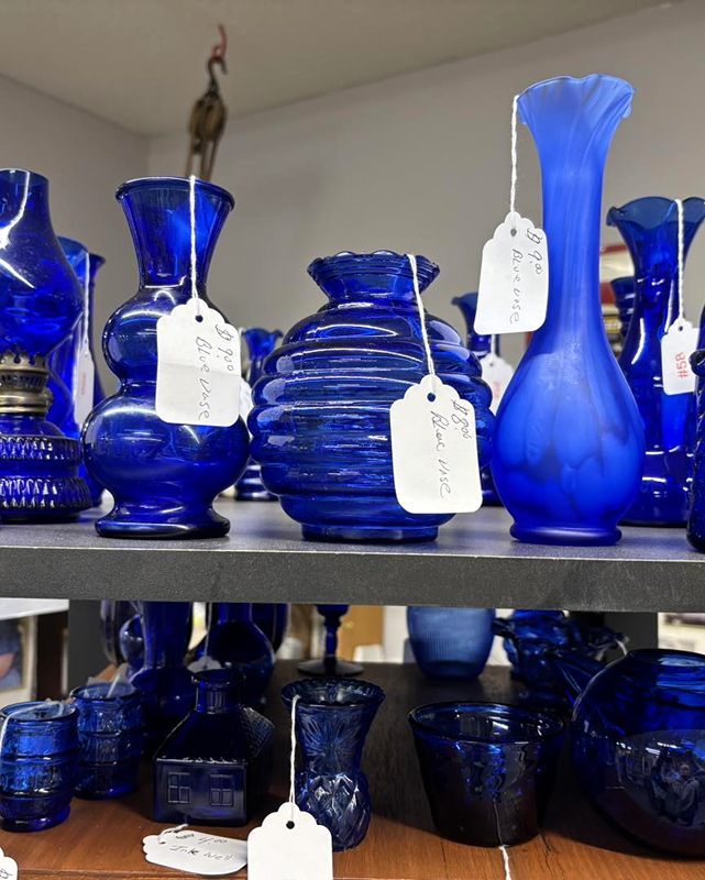 Cobalt blue glass vases with handwritten paper price tags