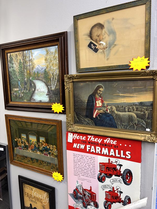Framed prints, including a Last Supper print, and a Farmall tractor poster