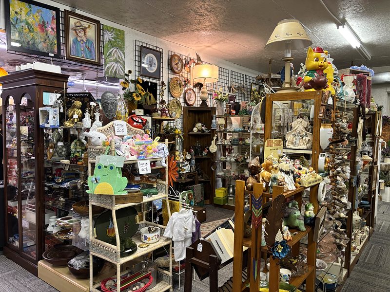 Glass cabinets and shelves full of figurines, plush toys and knickknacks