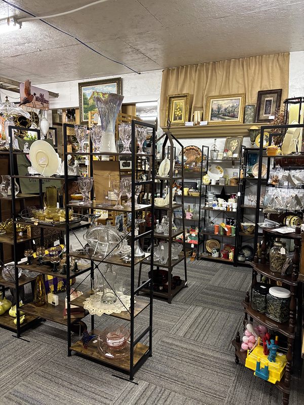 Metal-and-glass shelves of glassware and crystal